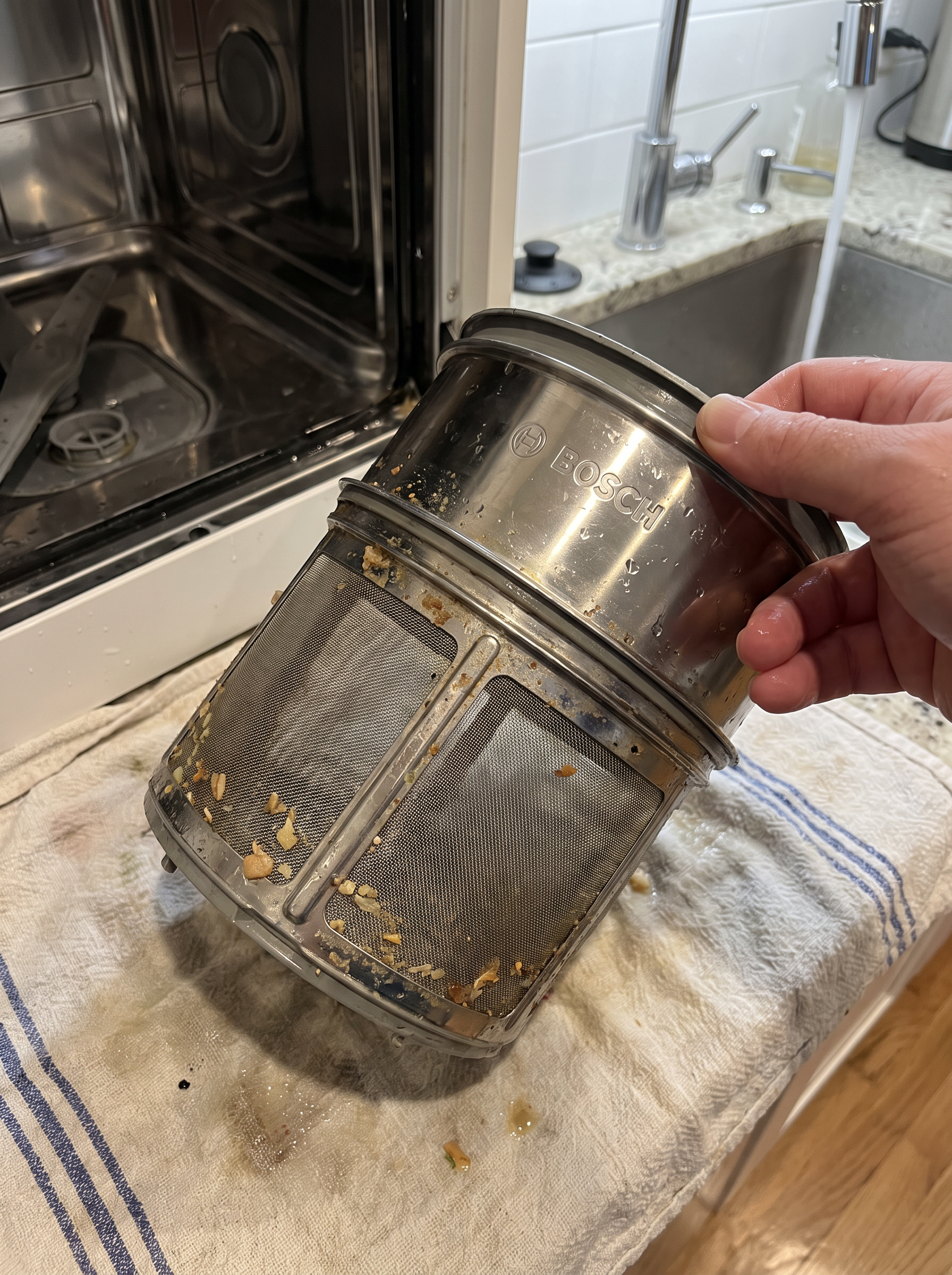 Bosch dishwasher filter removed from the bottom of the tub for cleaning
